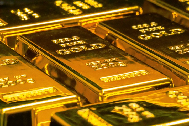 Gold bars in a vault — stand-in for PAXG as issuer-controlled tokenized gold, not a bearer coin.