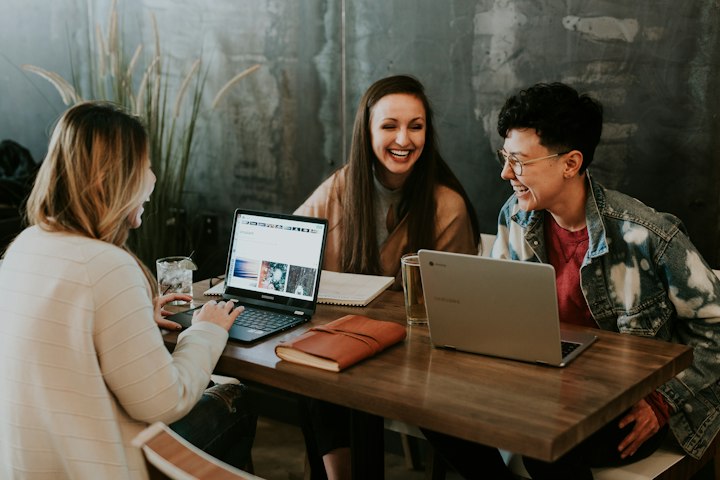 People reviewing a laptop together — the P2P deal pack is a chat export, a sending address, and a scan URL.