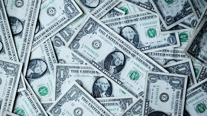 US dollar notes — stand-in for two dollar-stablecoin issuers with different freeze desks.